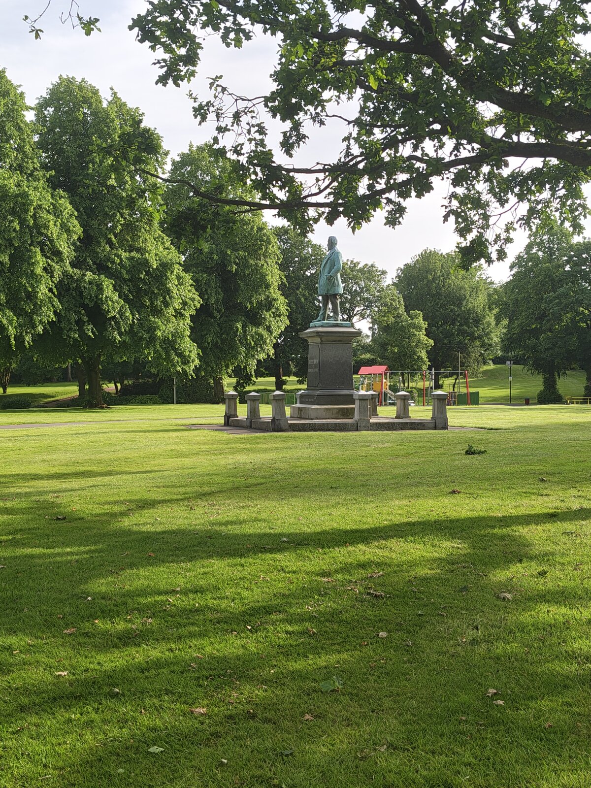 The park's memorial statue seen from across the wide green lawn