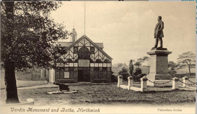 Edwardian postcard titled 'Verdin Monument and Baths, Northwich' — the timber-framed baths building, the Robert Verdin statue, and the lower park lawn